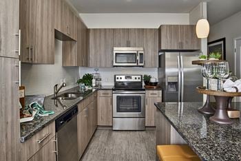 Enclave at Cherry Creek - Gray-toned wood cabinets with modern hardware